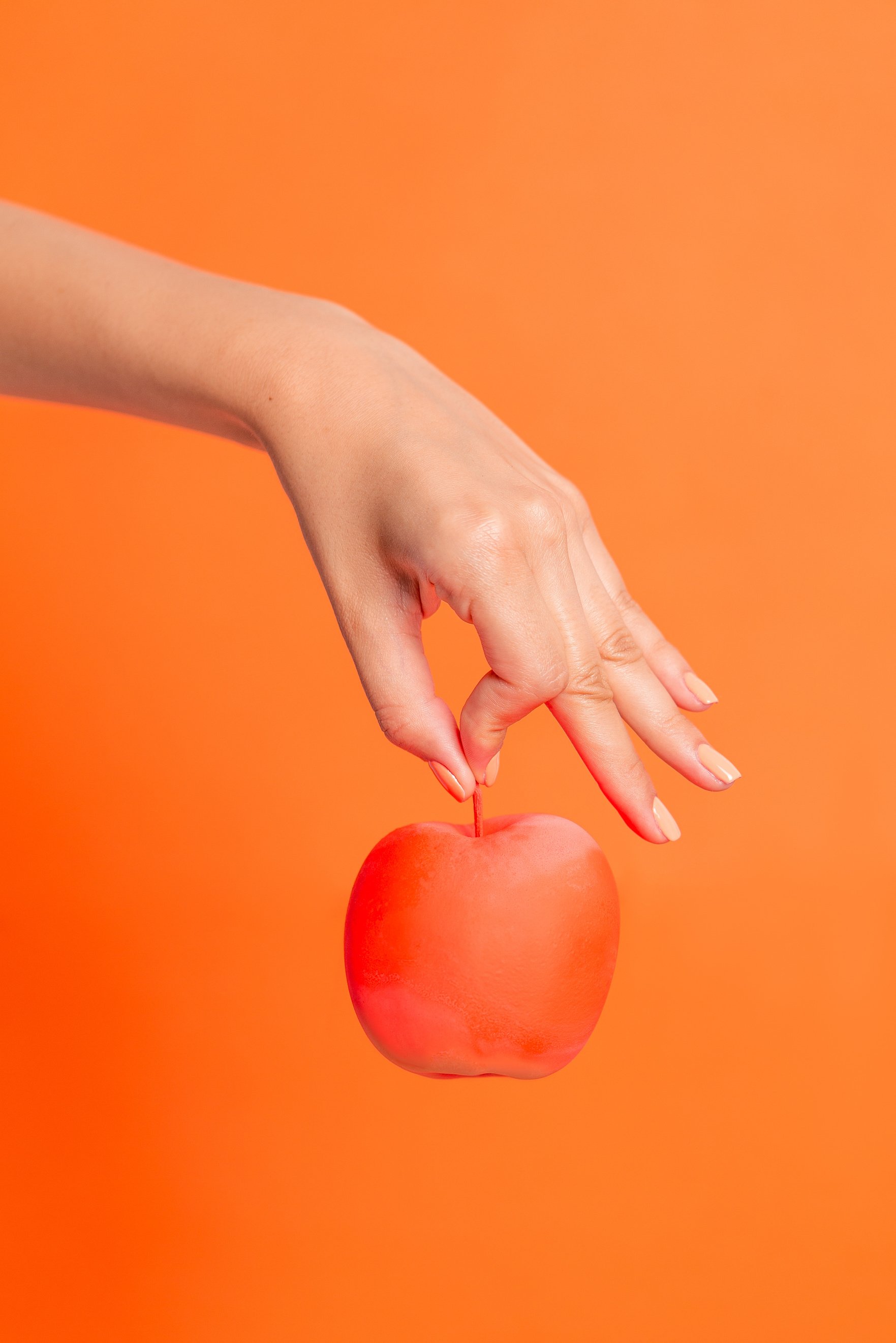 Hand Holding an Apple 